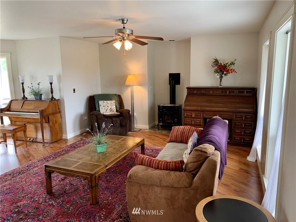 52 Greywolf Road Sequim, WA 98382 - Photo 6 of 31 a living room with furniture and a fireplace