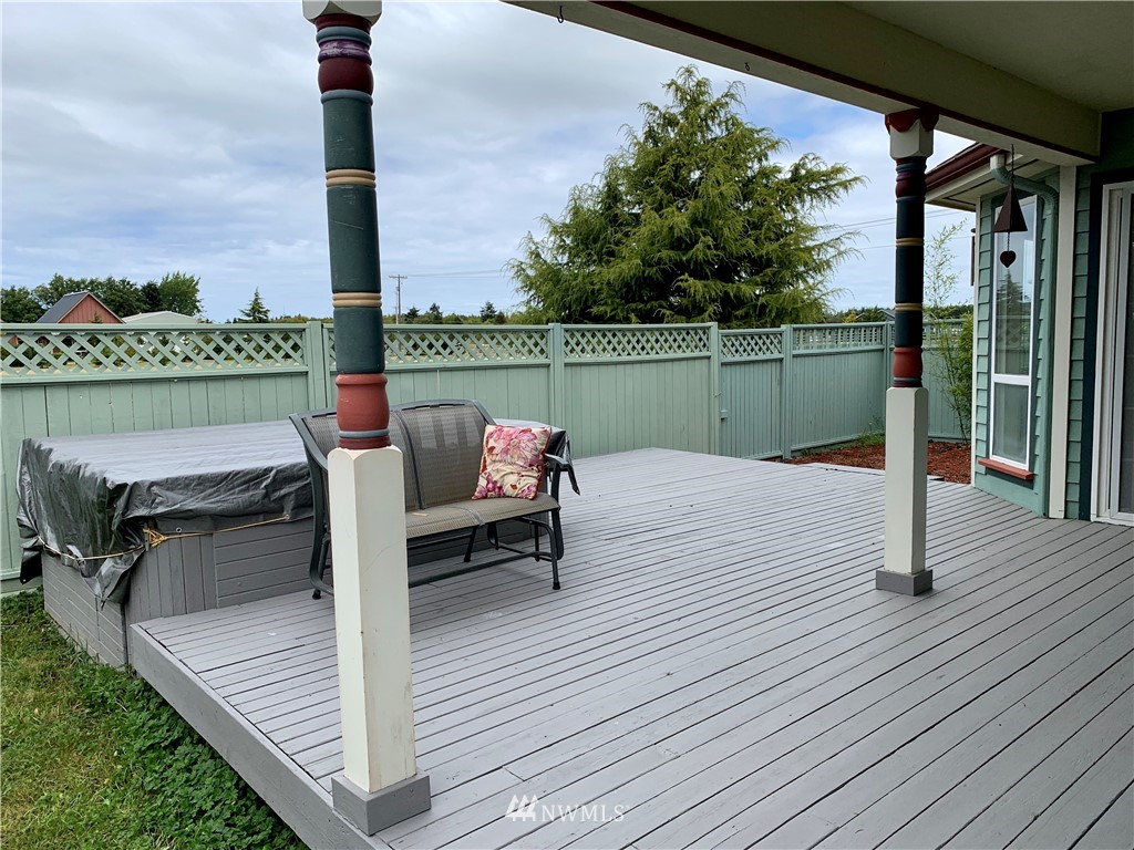52 Greywolf Road Sequim, WA 98382 - Photo 9 of 31 a roof deck with table and chairs