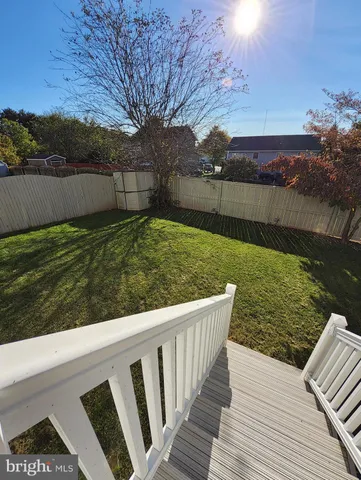 a view of backyard with seating space
