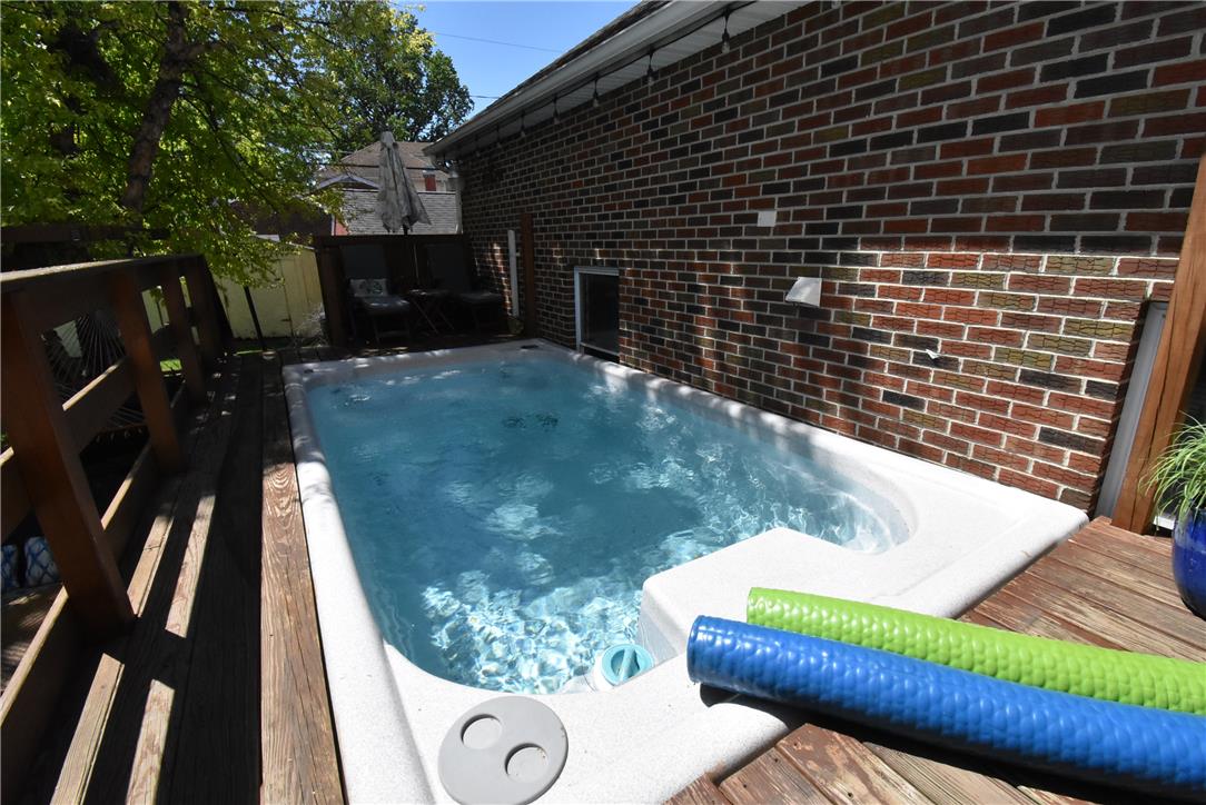 424 Grape Street Whitehall, PA 18052 - Photo 39 of 50 A secluded spa pool nestled on a wooden deck, perfect for tranquil relaxation or fitness.