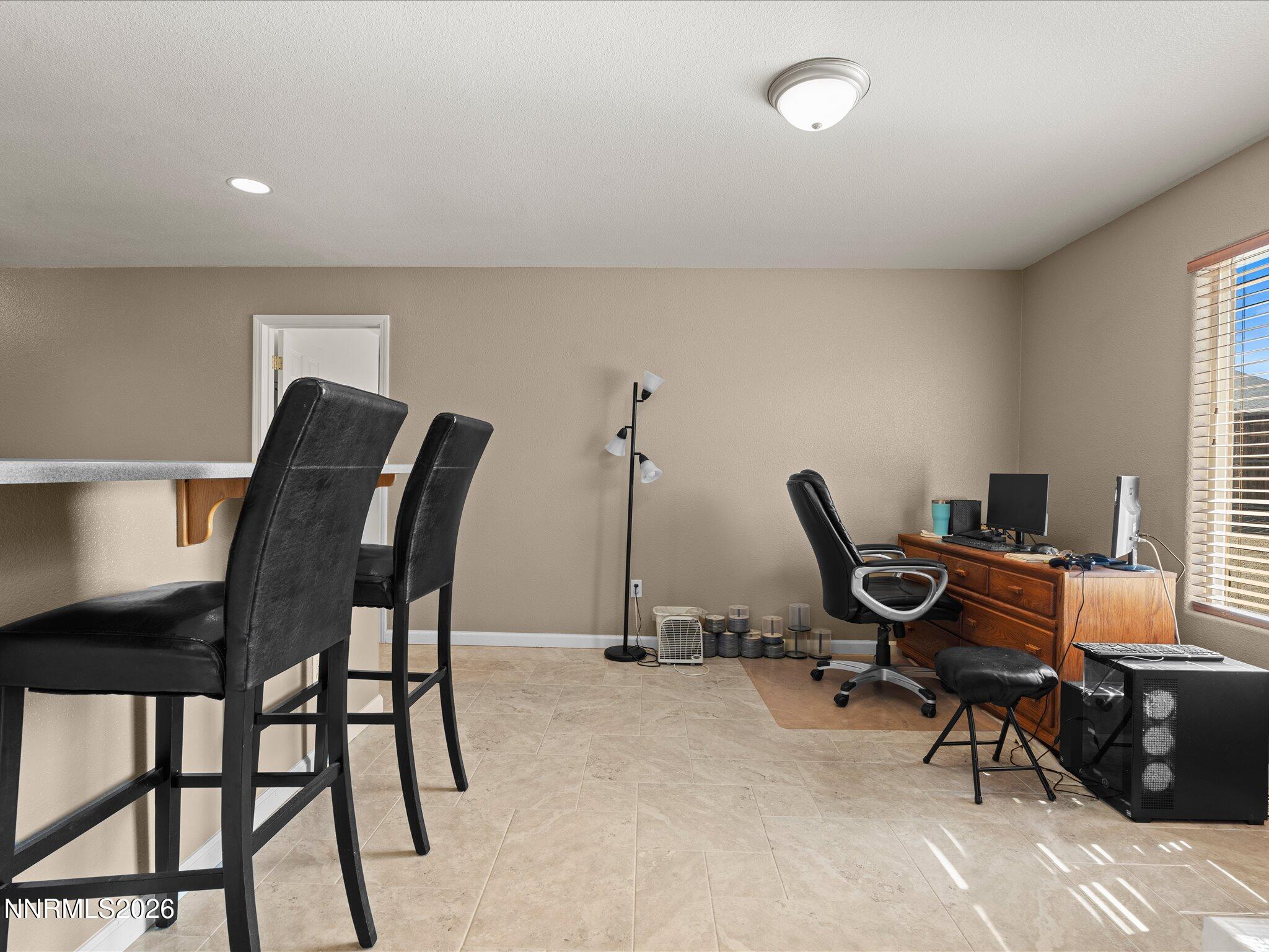 400 Bens Way Fernley, NV 89408 - Photo 14 of 31 a view of a workspace with furniture and a window