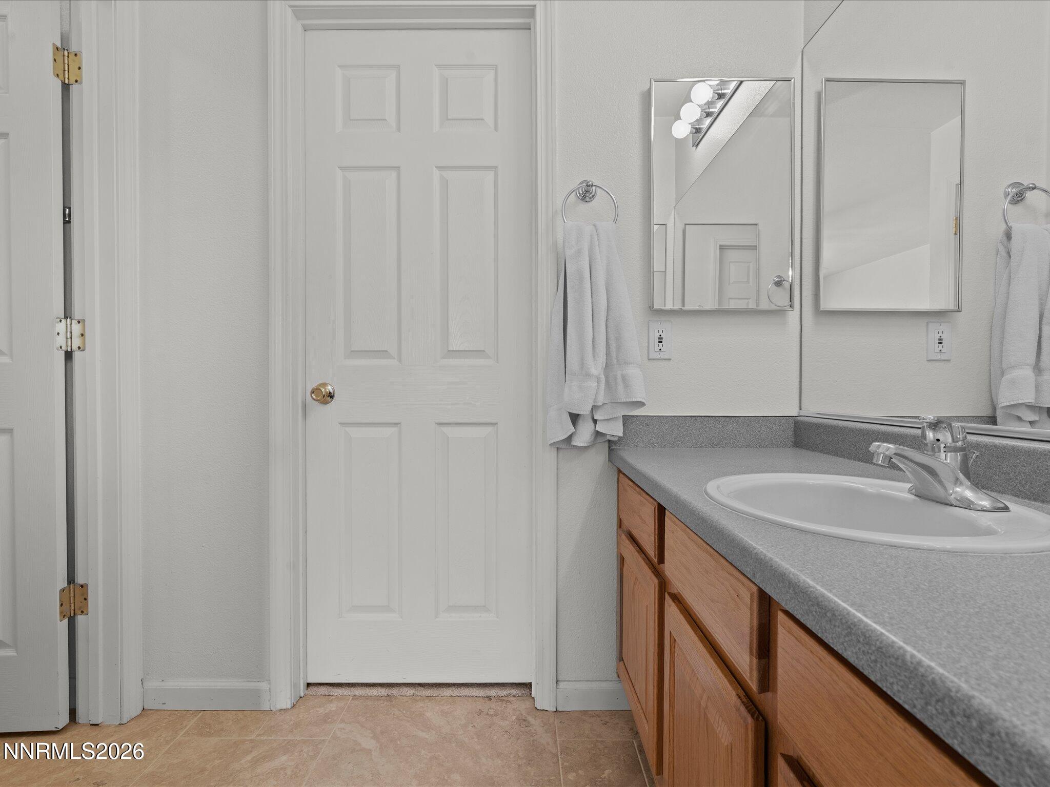 400 Bens Way Fernley, NV 89408 - Photo 19 of 31 a bathroom with a sink and a mirror