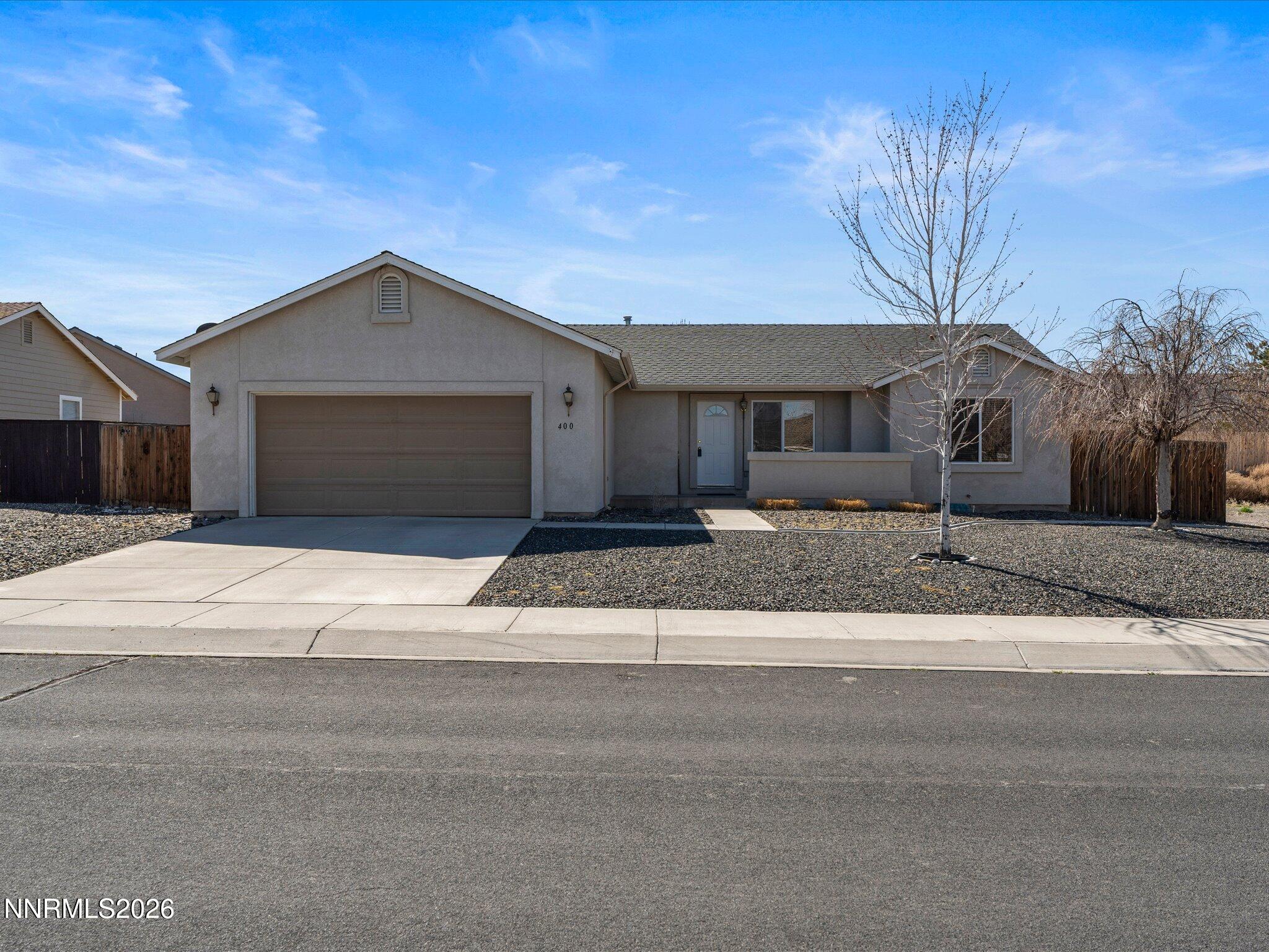 400 Bens Way Fernley, NV 89408 - Photo 2 of 31 a front view of a house with a yard