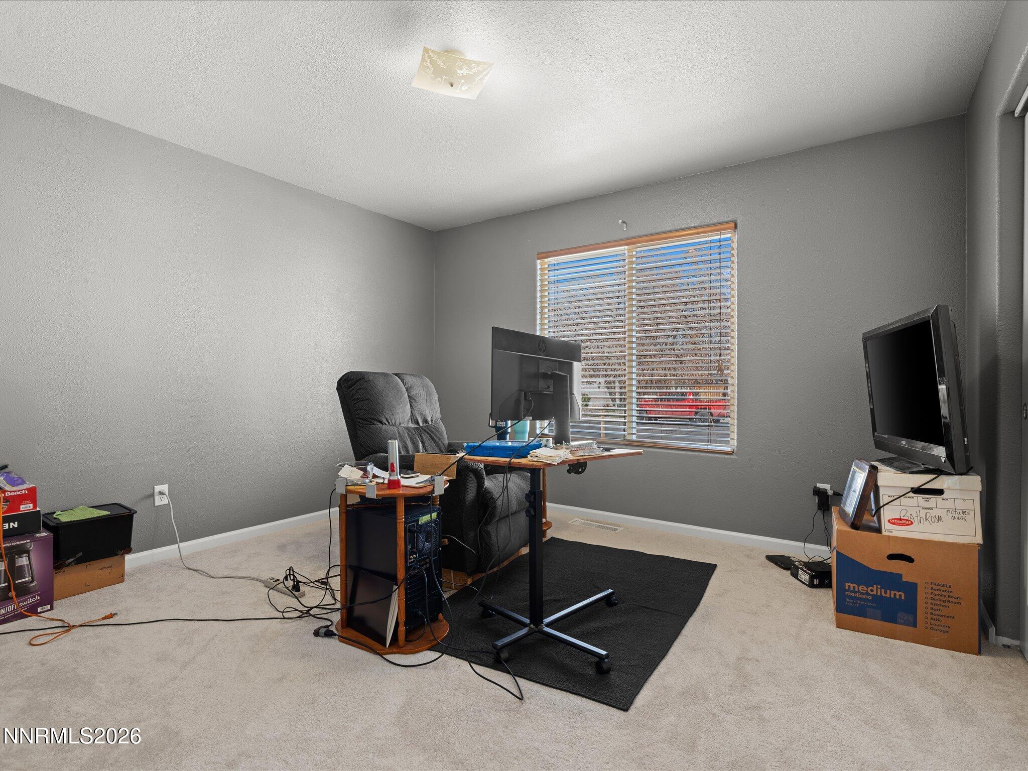 400 Bens Way Fernley, NV 89408 - Photo 26 of 31 a view of a workspace with furniture and a window