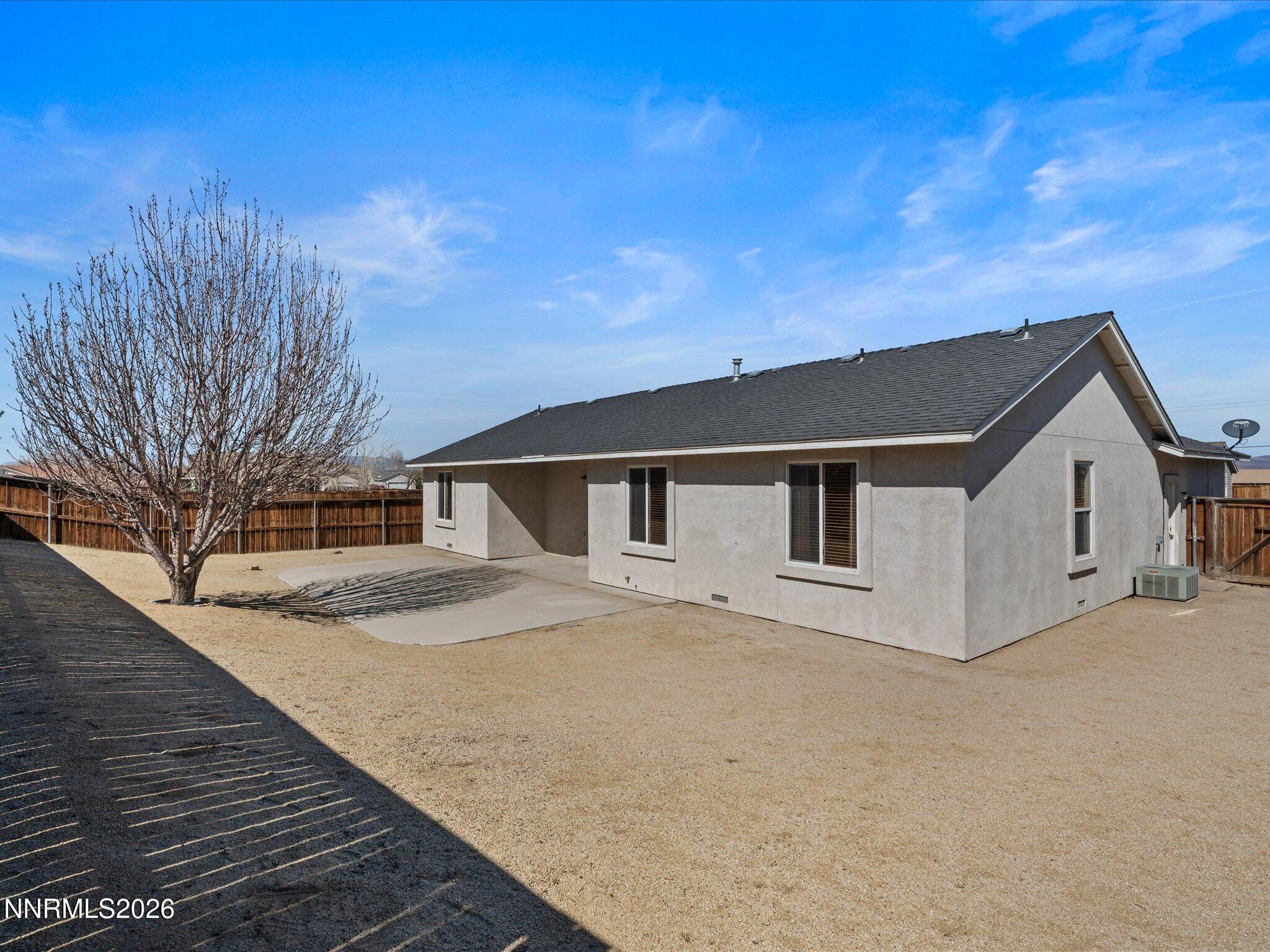 400 Bens Way Fernley, NV 89408 - Photo 30 of 31 a house with trees in the background