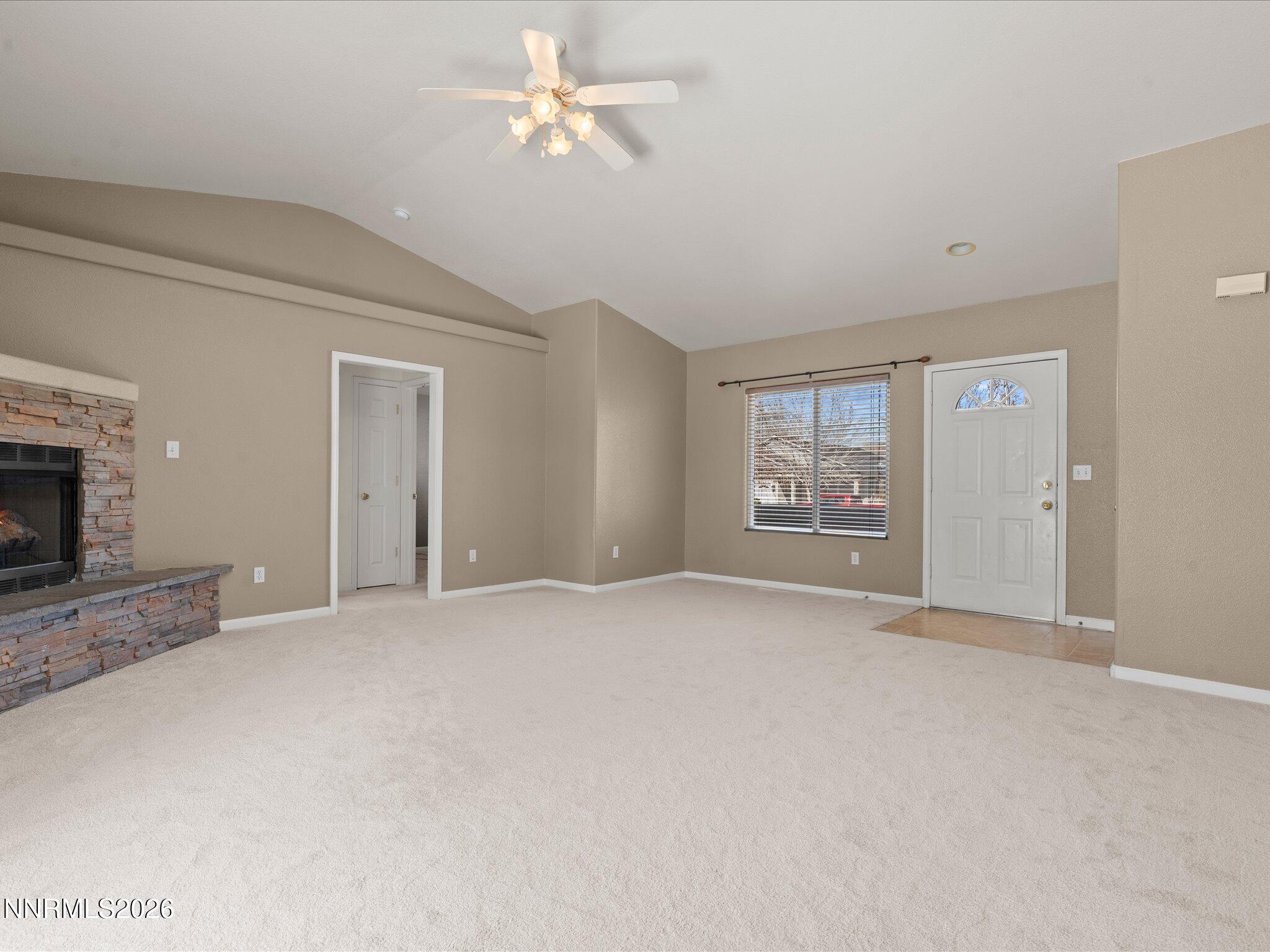 400 Bens Way Fernley, NV 89408 - Photo 4 of 31 a view of an empty room with a fireplace