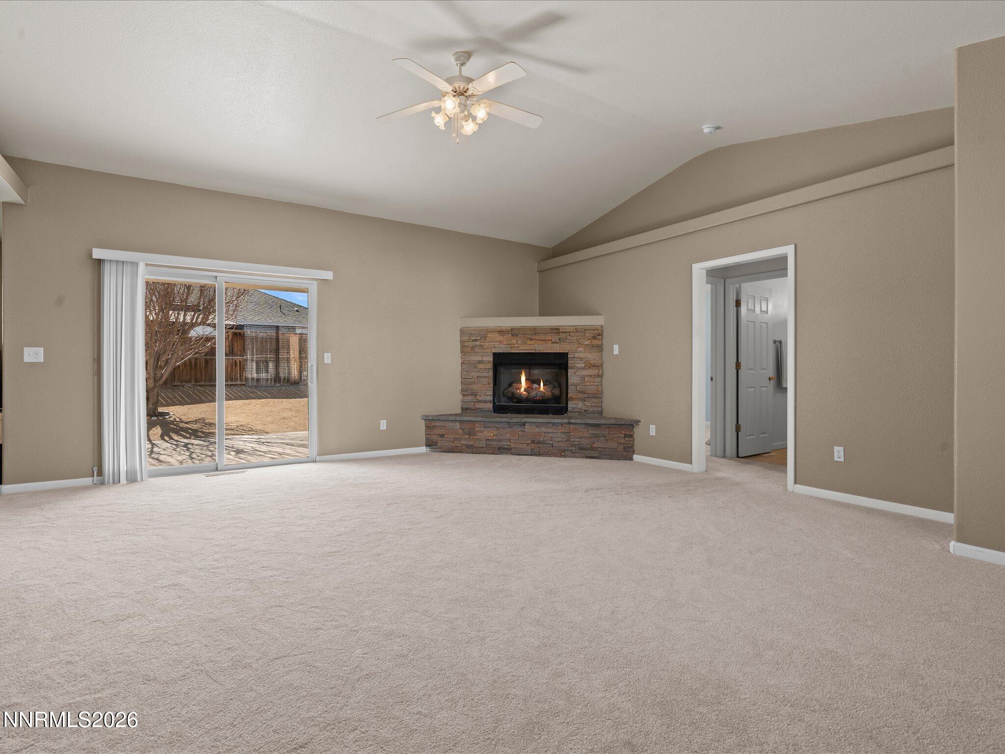 400 Bens Way Fernley, NV 89408 - Photo 5 of 31 a view of an empty room with a fireplace