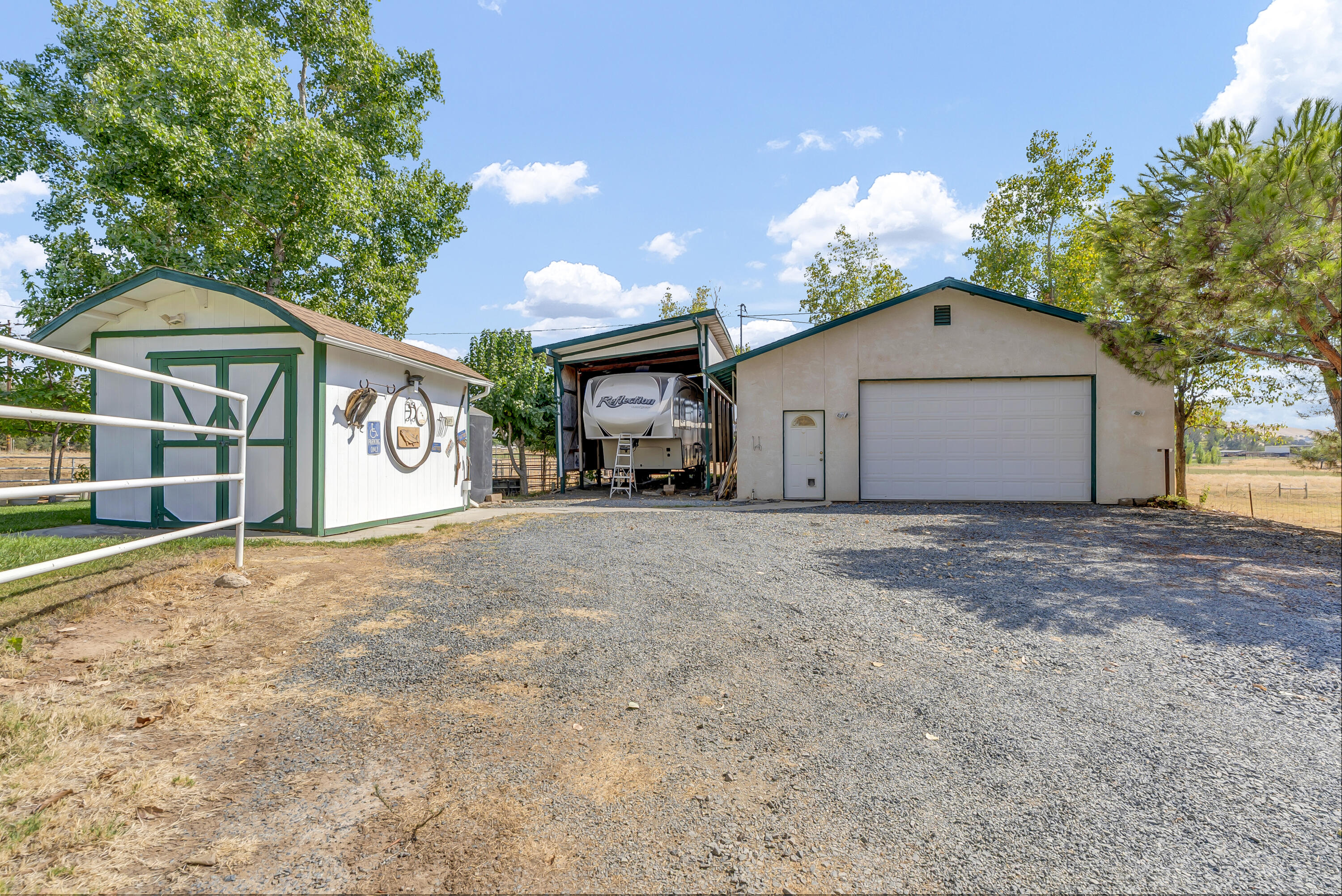 18002 320th Road Springville, CA 93265 - Photo 7 of 56 a view of a house with a yard and garage