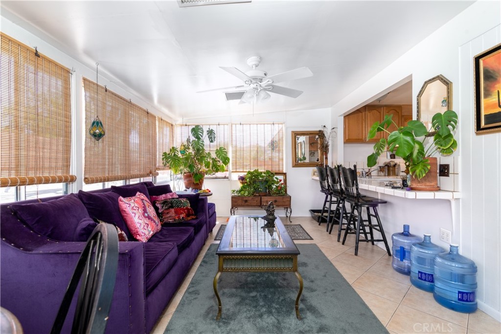 41320 Linda Vista Court Hemet, CA 92544 - Photo 15 of 31 a living room with furniture fireplace and a large window