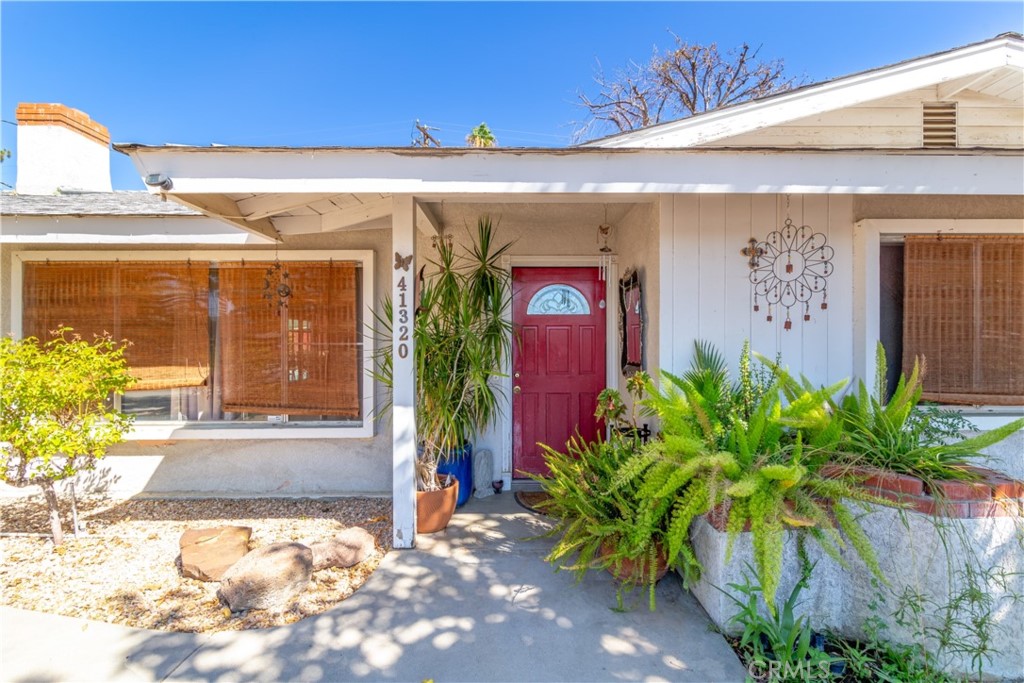 41320 Linda Vista Court Hemet, CA 92544 - Photo 3 of 31 a view of a building with potted plants