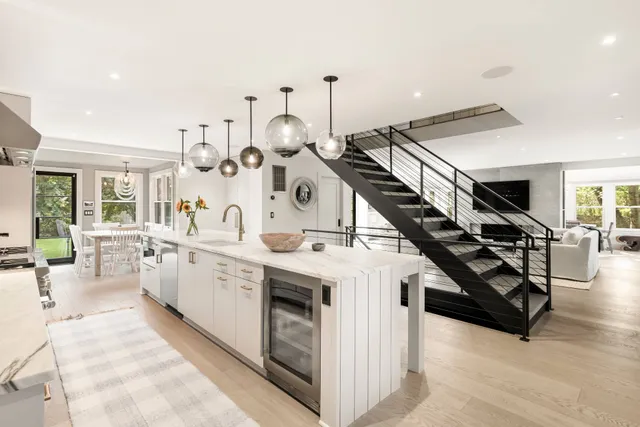 a kitchen with furniture a chandelier a stove and a chandelier