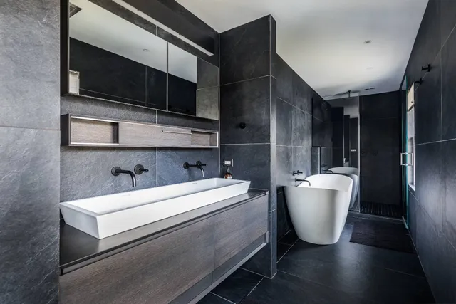 a room with a sink and a microwave