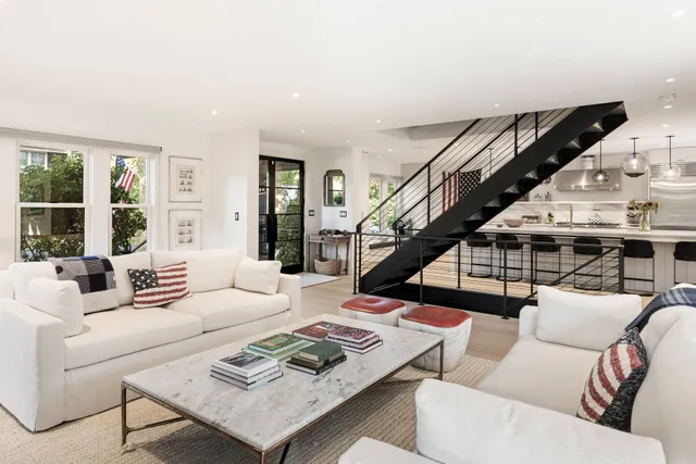 a living room with furniture and a rug