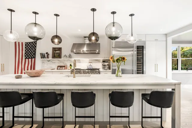 a kitchen with stainless steel appliances granite countertop a sink and cabinets