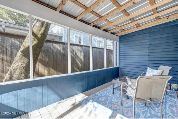 a kitchen with stainless steel appliances a refrigerator and a table