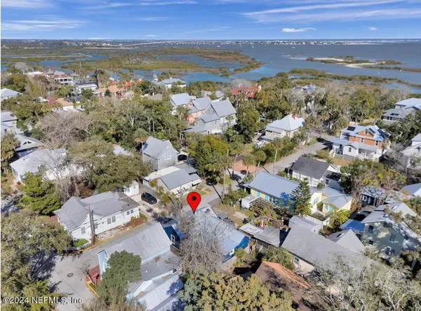 an aerial view of residential houses with outdoor space