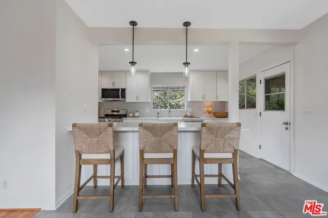 a bathroom with a bathtub and a sink