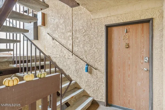a view of balcony with wooden floor and stairs