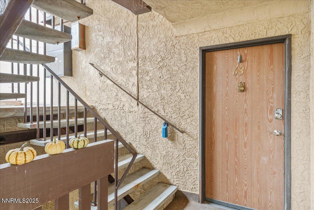 a view of balcony with wooden floor and stairs