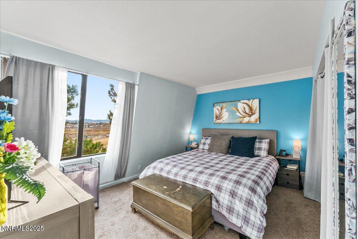 63 Vista Rafael Parkway Reno, NV 89503 - Photo 15 of 24 a bedroom with a bed and a window