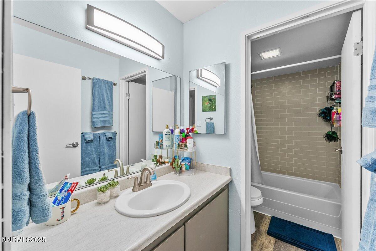 63 Vista Rafael Parkway Reno, NV 89503 - Photo 18 of 24 a bathroom with a sink vanity mirror and a bathtub