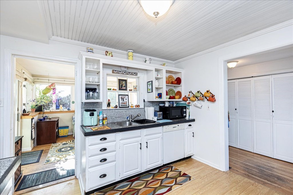 18 Bayview Road Ipswich, MA 01938 - Photo 8 of 21 a kitchen with granite countertop white cabinets and white appliances