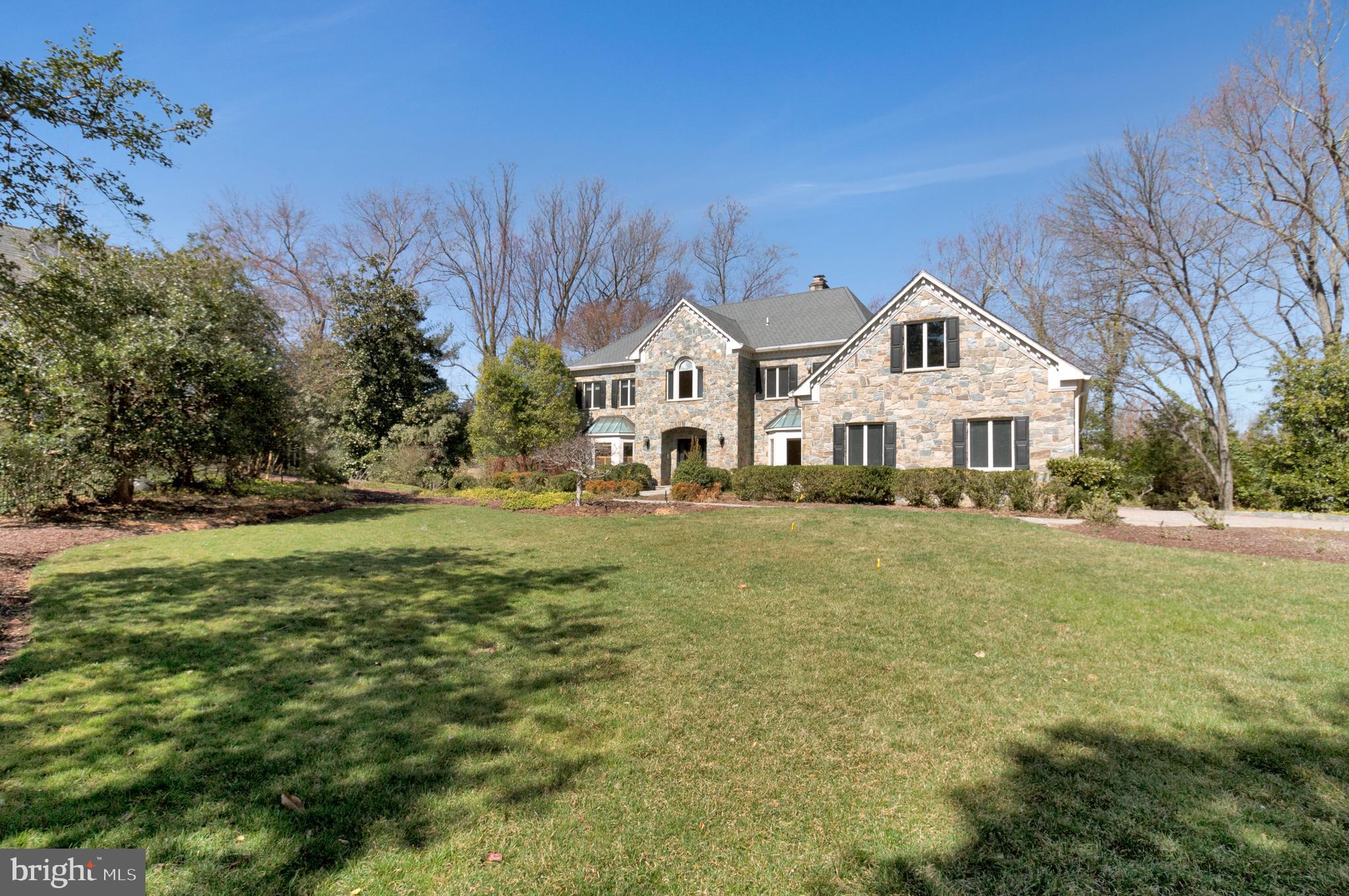 938 Douglass Drive McLean, VA 22101 - Photo 103 of 105 a front view of a house with a yard