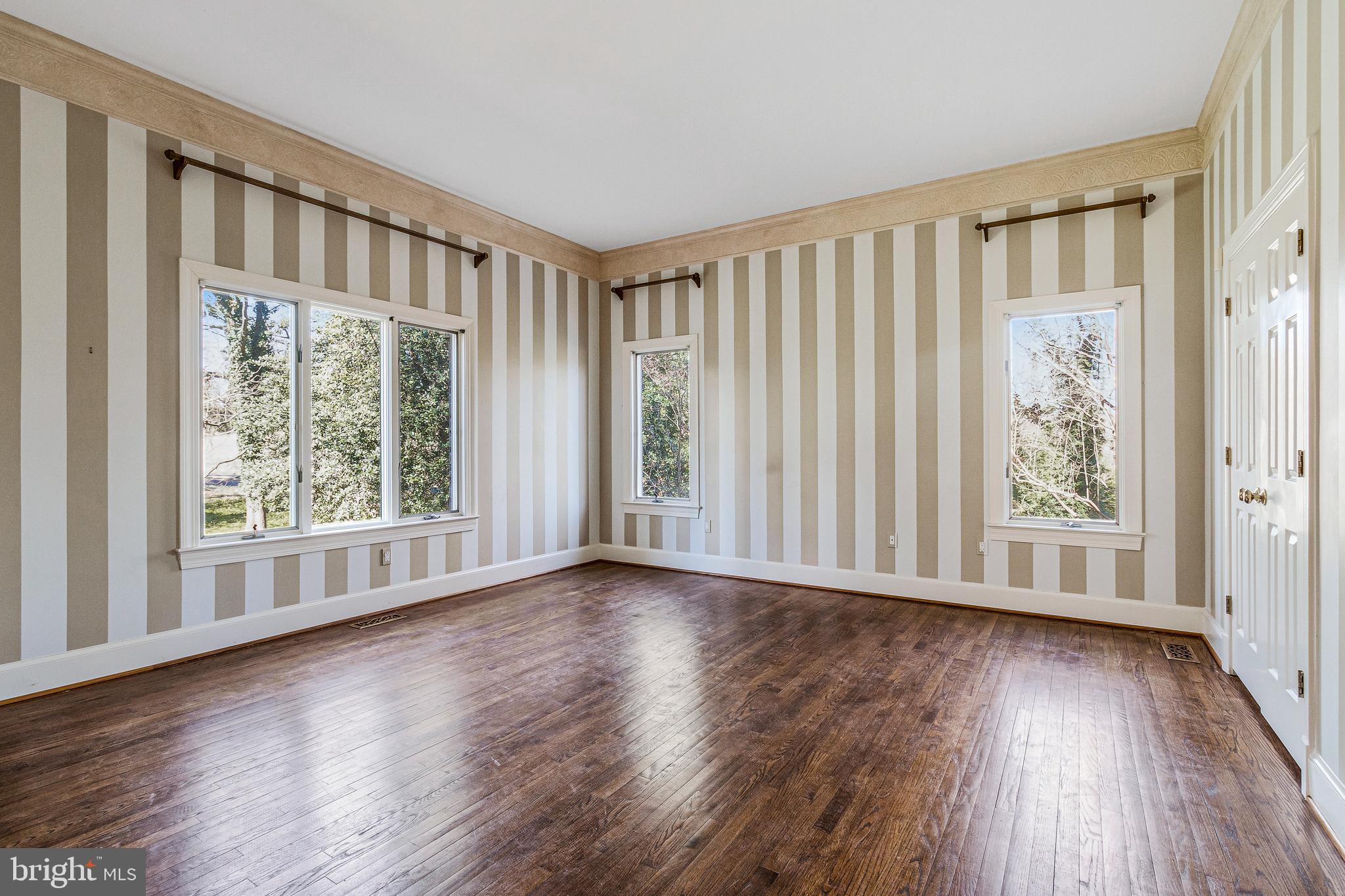 938 Douglass Drive McLean, VA 22101 - Photo 11 of 105 a view of an empty room with wooden floor and a window