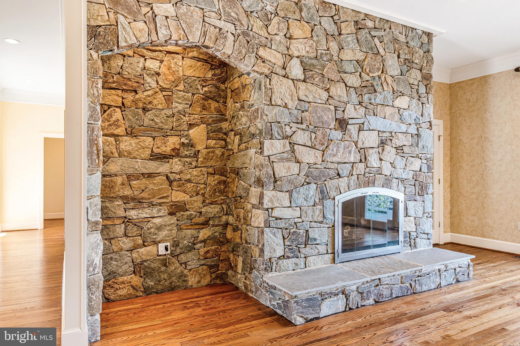 938 Douglass Drive McLean, VA 22101 - Photo 23 of 105 a living room with a wooden floor and a fireplace