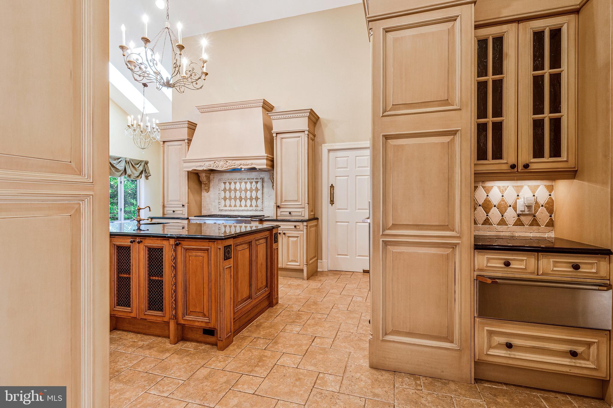 938 Douglass Drive McLean, VA 22101 - Photo 27 of 105 a kitchen with stainless steel appliances granite countertop a refrigerator and a stove