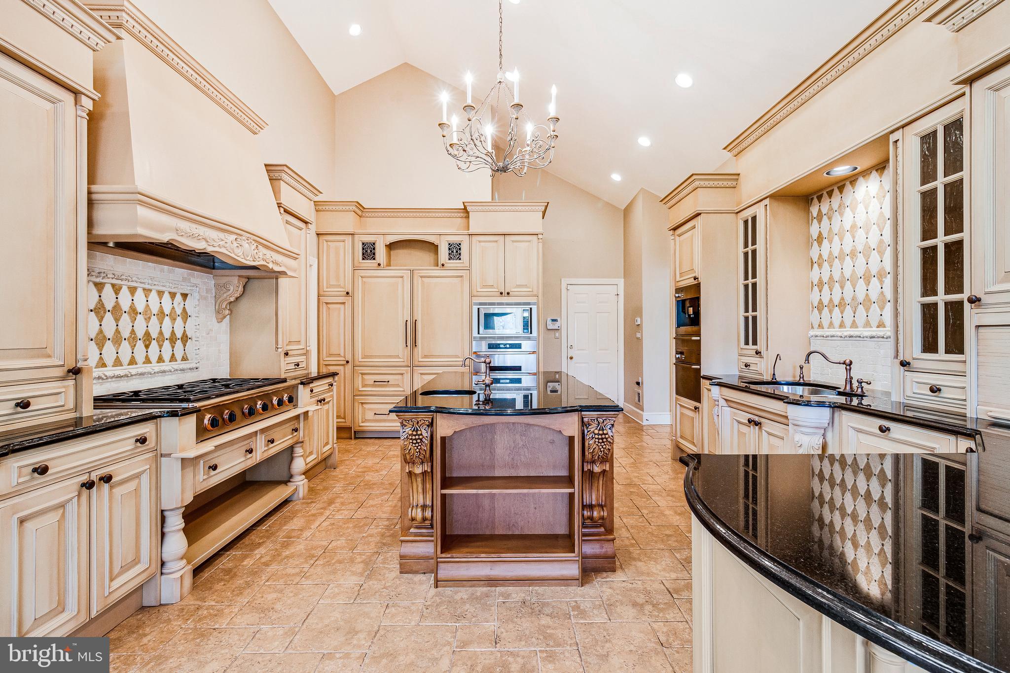 938 Douglass Drive McLean, VA 22101 - Photo 32 of 105 a large kitchen with stainless steel appliances granite countertop a stove and a center island
