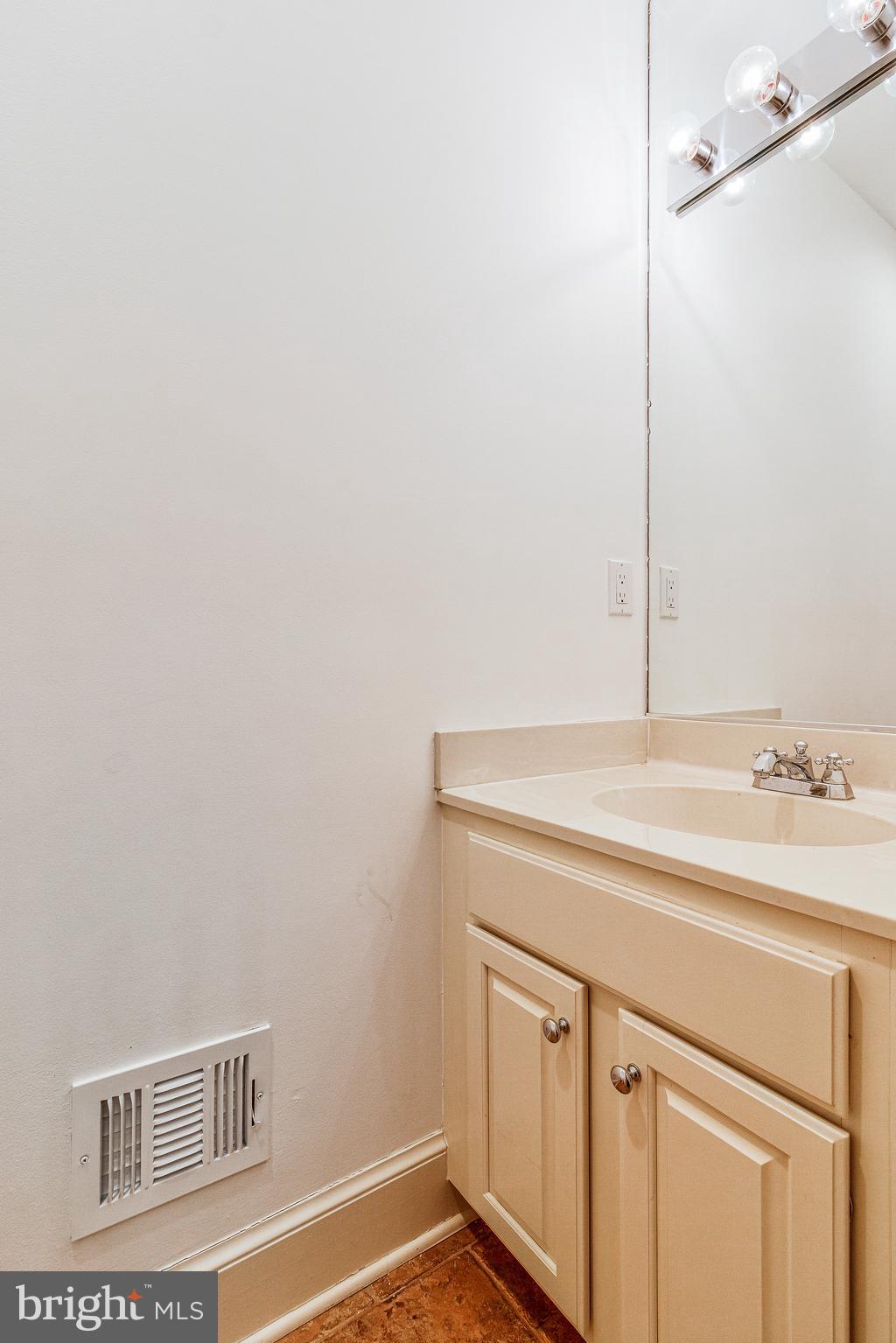 938 Douglass Drive McLean, VA 22101 - Photo 35 of 105 a bathroom with a sink and a mirror