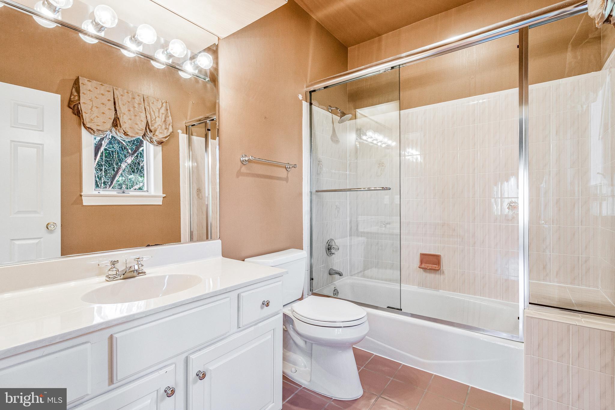 938 Douglass Drive McLean, VA 22101 - Photo 48 of 105 a bathroom with a sink a toilet and shower
