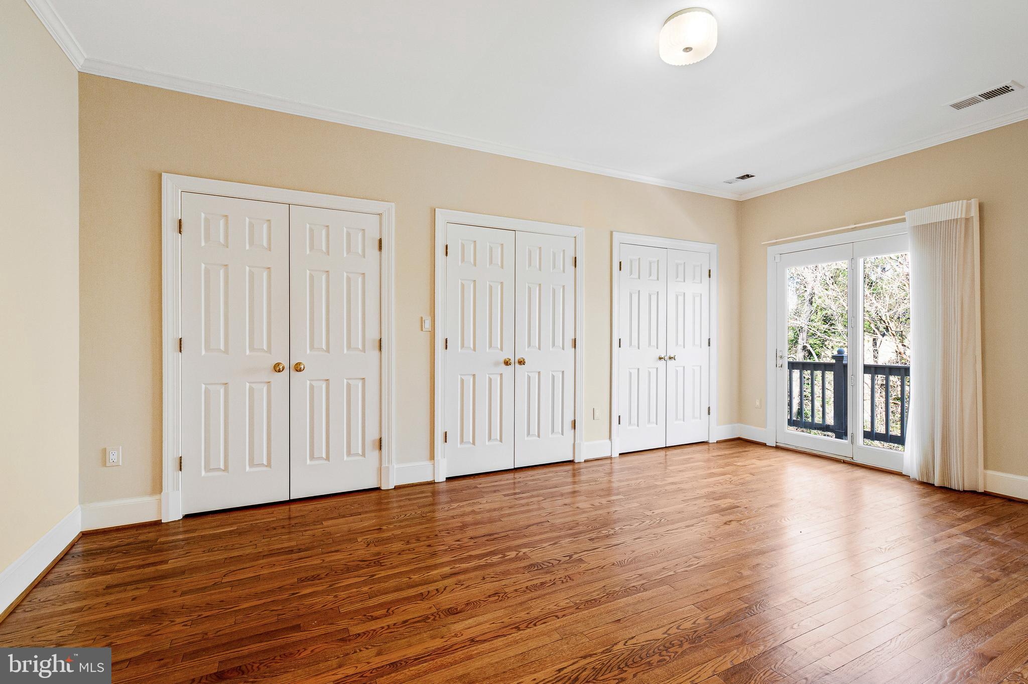 938 Douglass Drive McLean, VA 22101 - Photo 50 of 105 a view of an empty room with wooden floor
