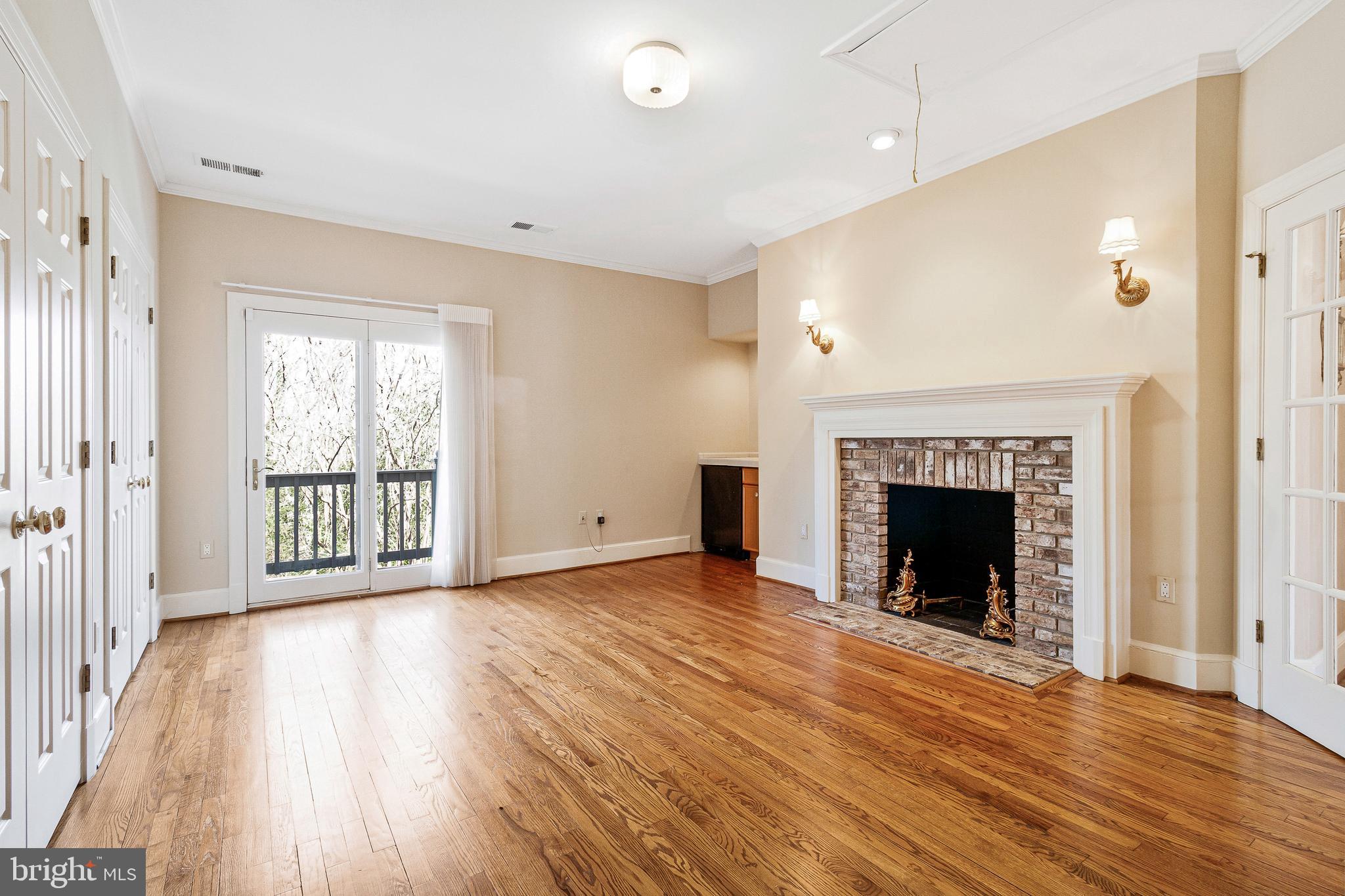 938 Douglass Drive McLean, VA 22101 - Photo 51 of 105 a view of an empty room with wooden floor and a window