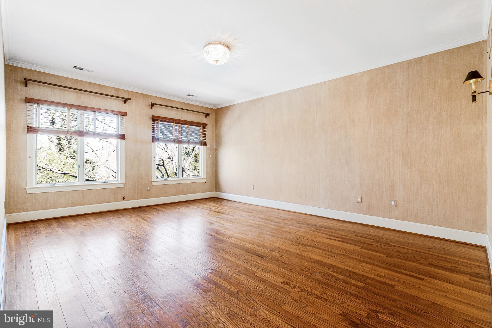 938 Douglass Drive McLean, VA 22101 - Photo 54 of 105 an empty room with wooden floor and windows