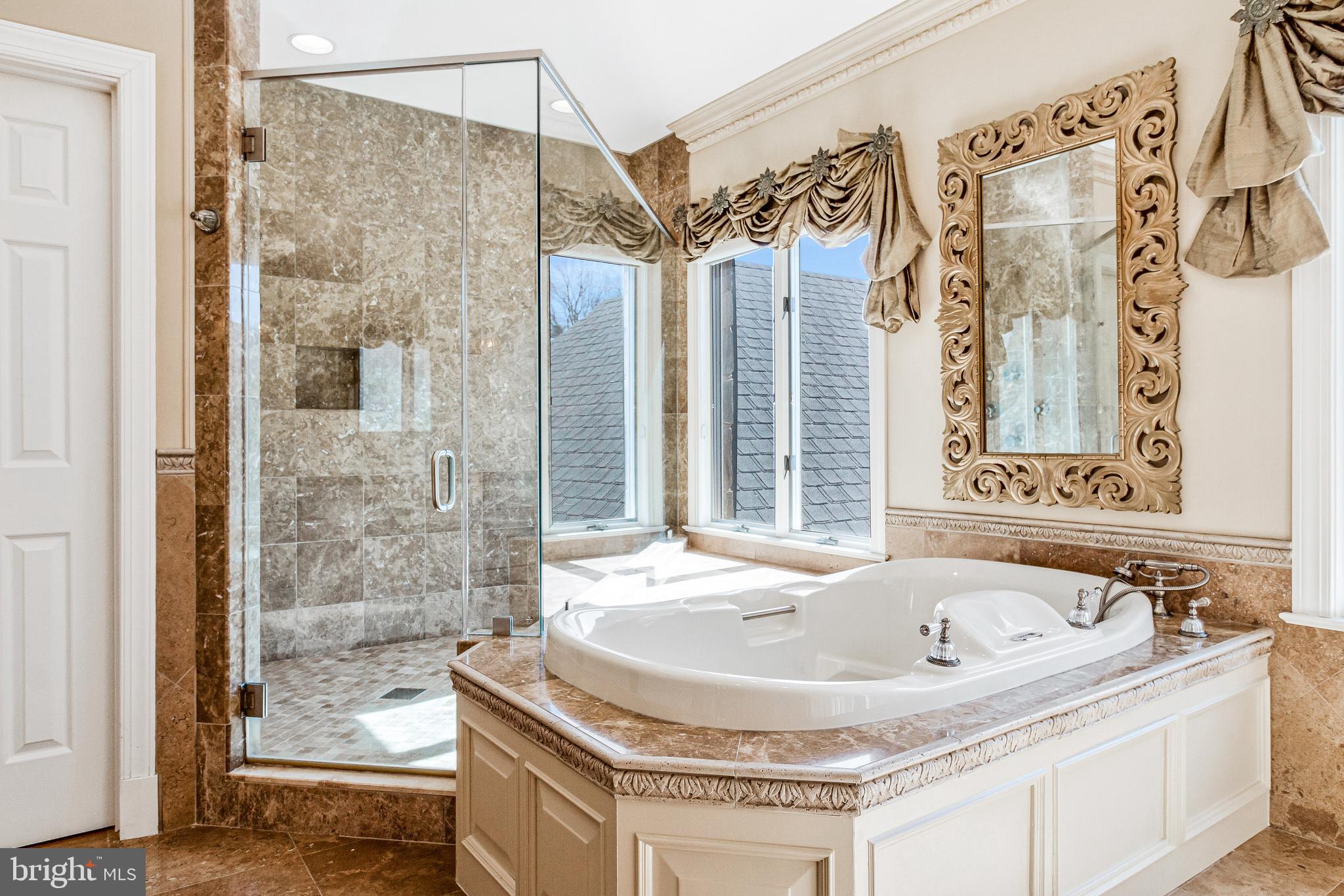 938 Douglass Drive McLean, VA 22101 - Photo 58 of 105 a bathroom with a tub and shower