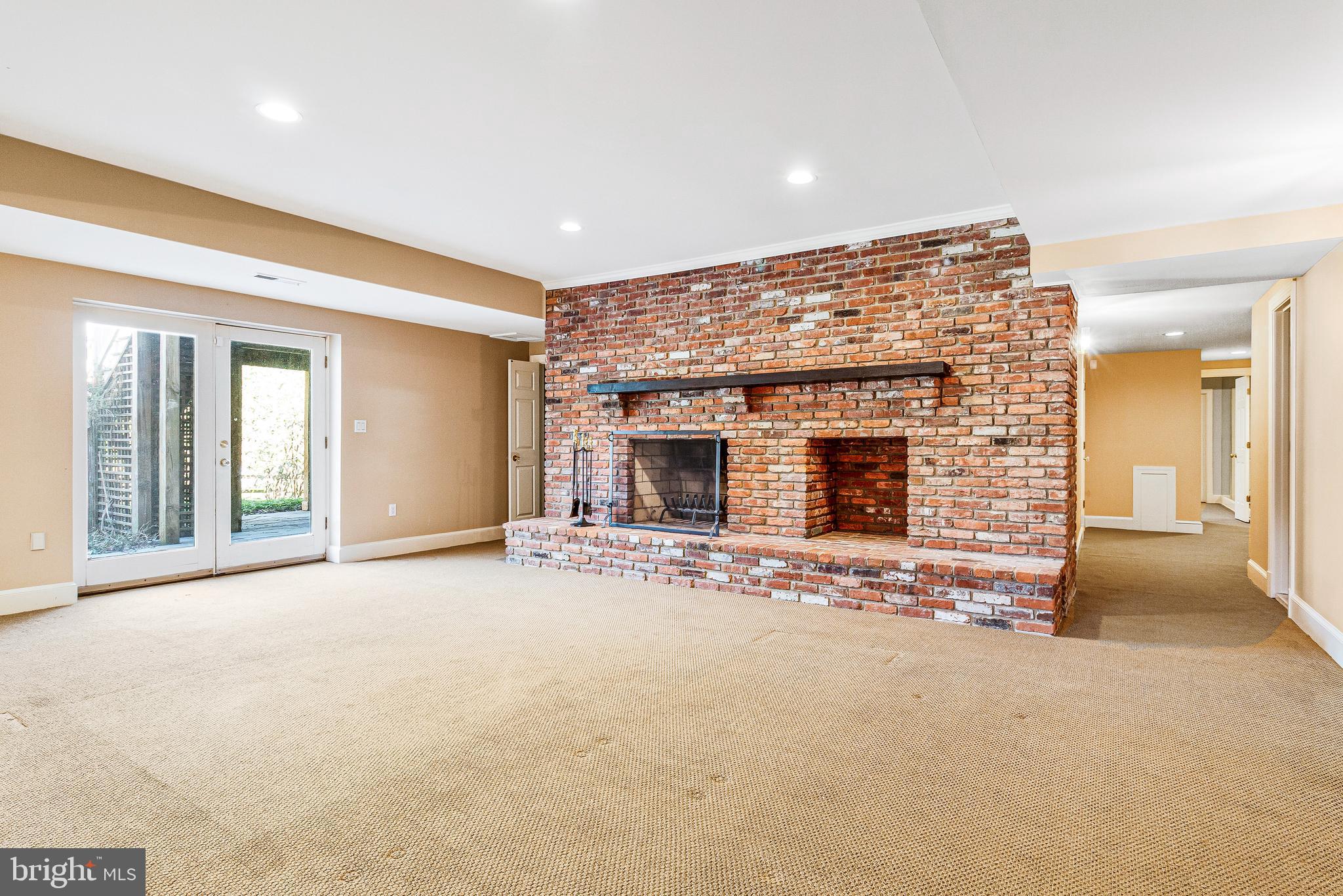 938 Douglass Drive McLean, VA 22101 - Photo 73 of 105 a view of a livingroom with an empty space and a fireplace