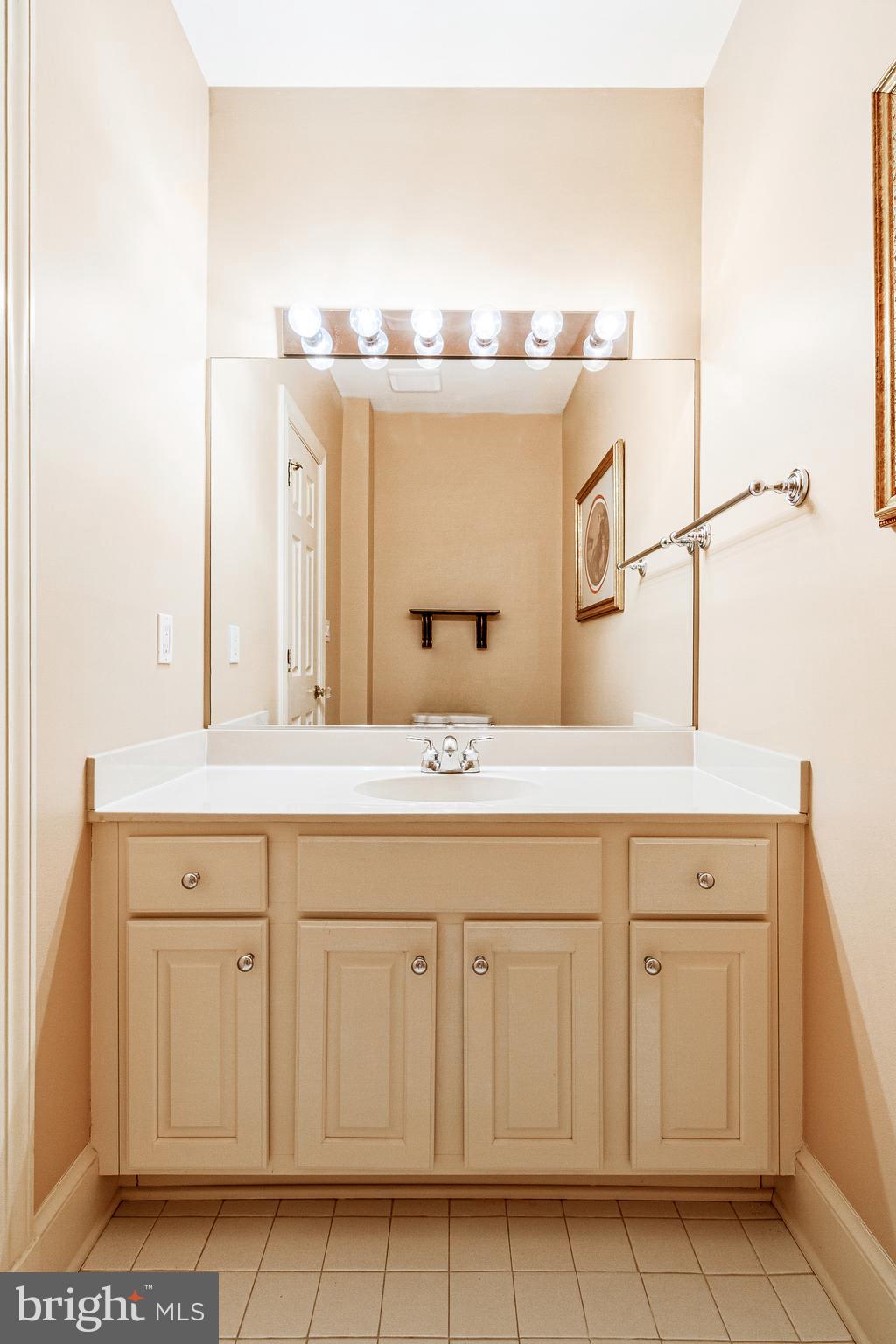 938 Douglass Drive McLean, VA 22101 - Photo 75 of 105 a bathroom with a sink and a mirror