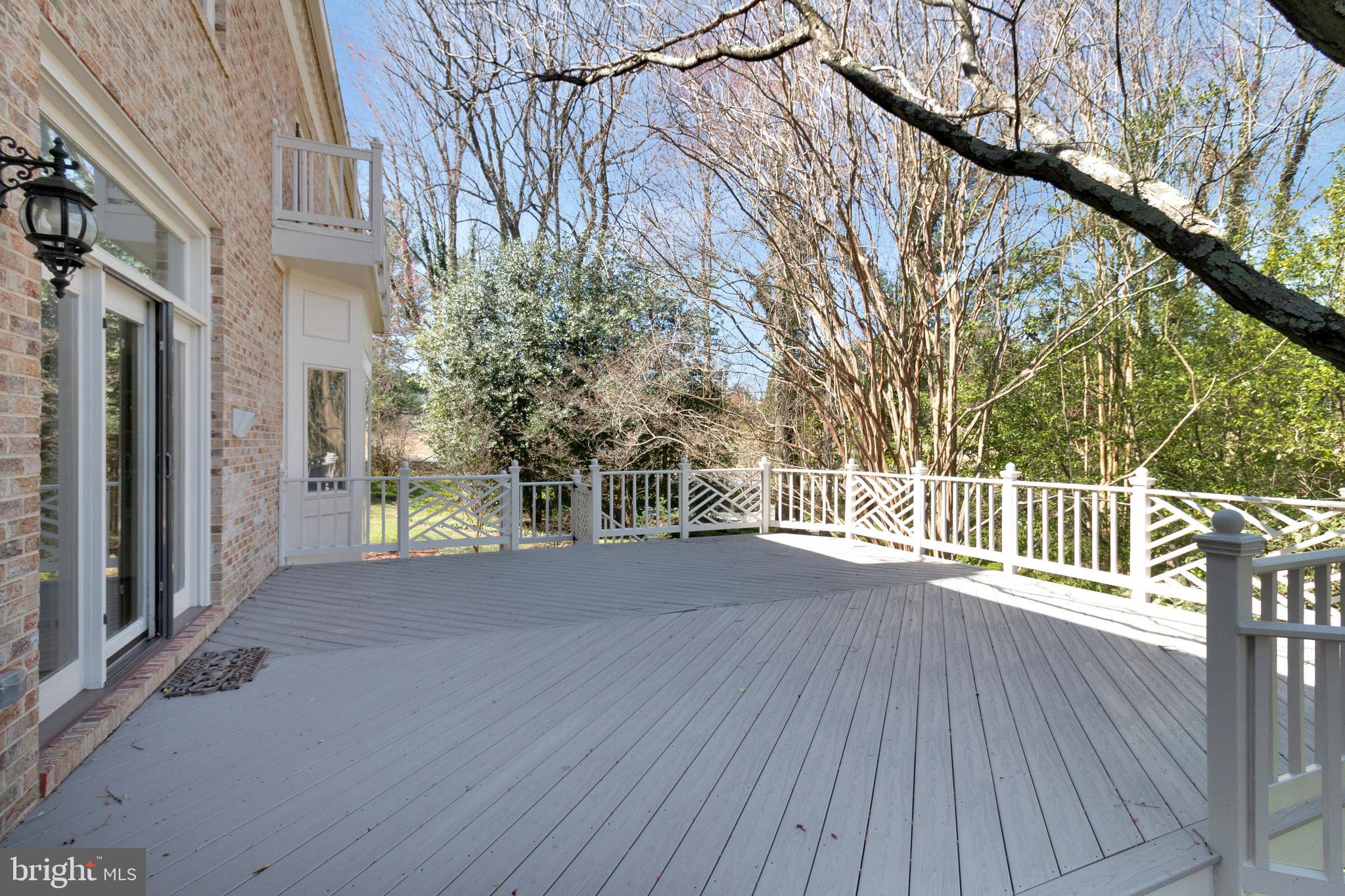 938 Douglass Drive McLean, VA 22101 - Photo 91 of 105 a view of backyard with a deck and wooden floor