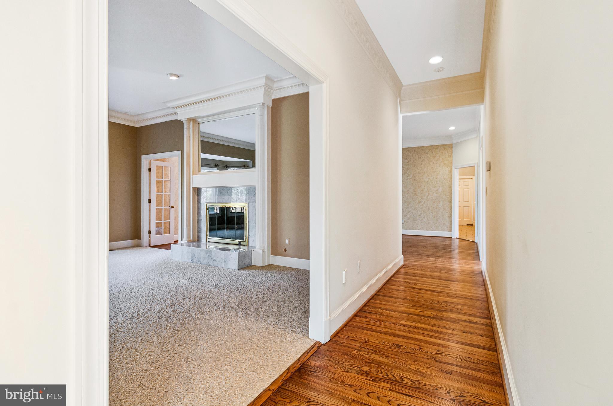 938 Douglass Drive McLean, VA 22101 - Photo 10 of 105 a view of a hallway with wooden floor and a bathroom