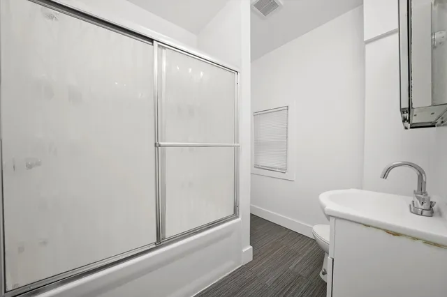 a bathroom with a sink and mirror