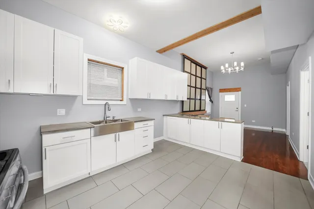 a kitchen with a sink and cabinets