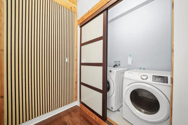 a view of a hallway with washer and dryer