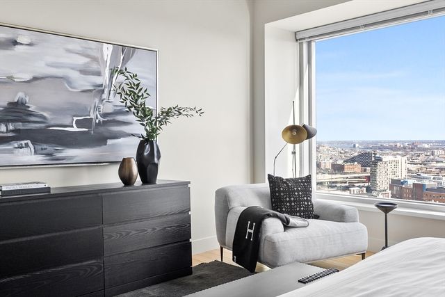a view of living room with furniture and lamp