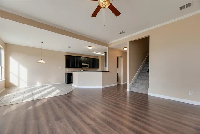 a view of a kitchen with a sink and a microwave