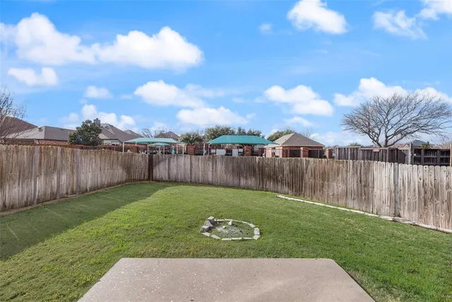 a view of a backyard with a garden