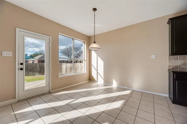 a view of a room that has a bed furniture and a window