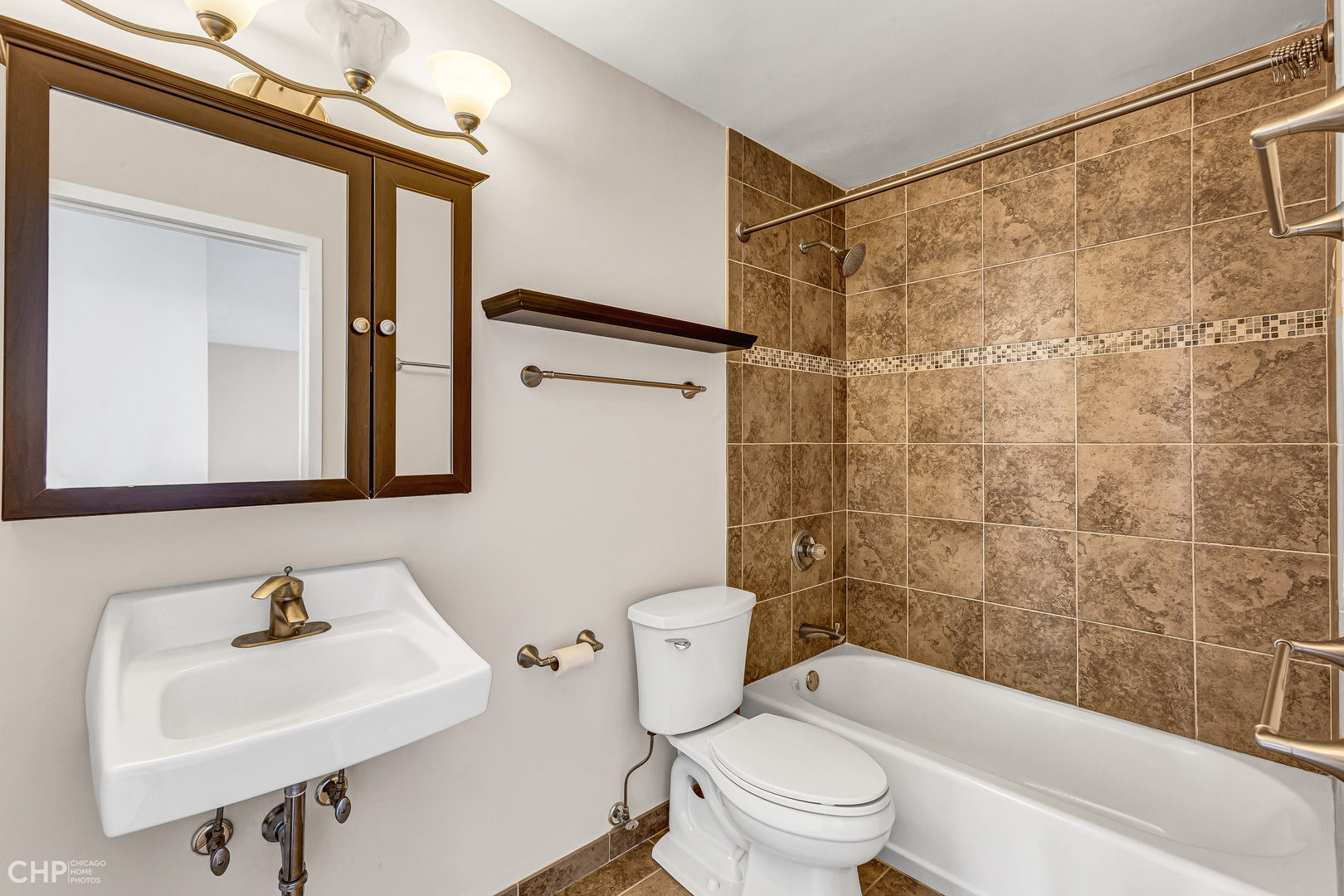 5320 North Sheridan Road, Unit 2002 Chicago, IL 60640 - Photo 30 of 57 a bathroom with a sink toilet and shower