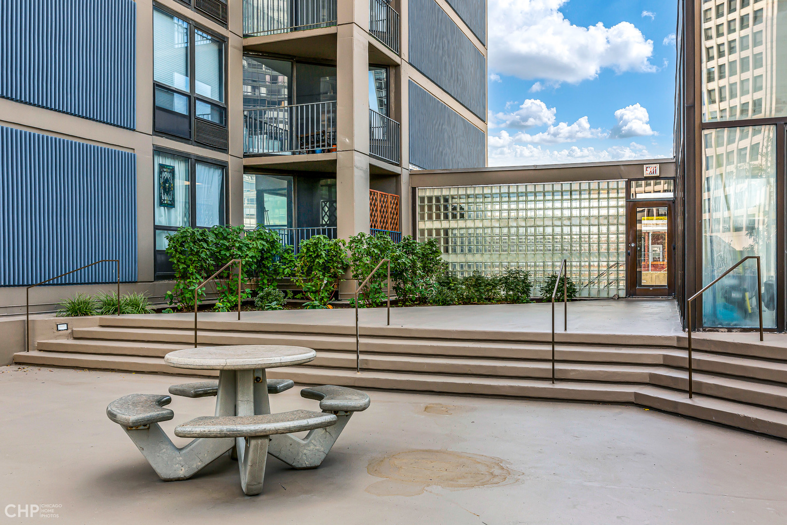 5320 North Sheridan Road, Unit 2002 Chicago, IL 60640 - Photo 39 of 57 a view of a bench sitting in front of a building